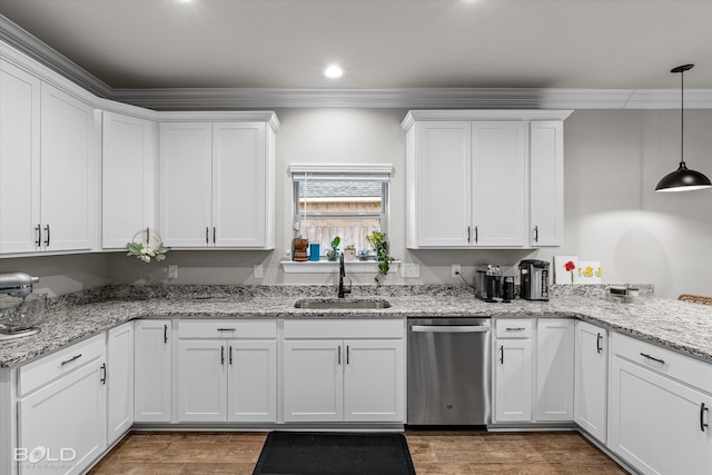 kitchen featuring sink, white cabinetry, crown molding, decorative light fixtures, and dishwasher