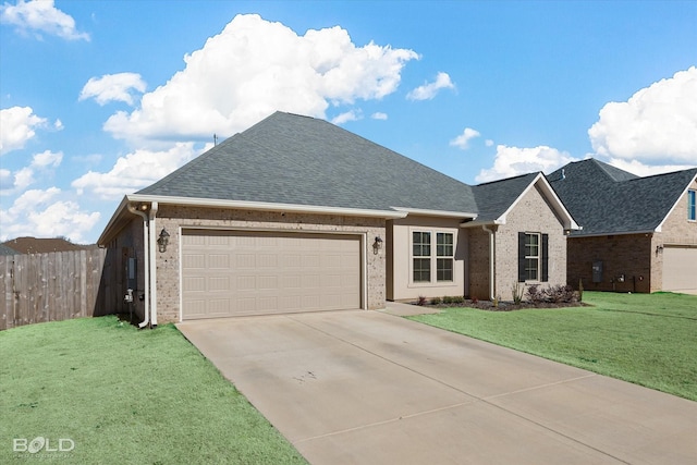 view of front facade featuring a garage and a front yard