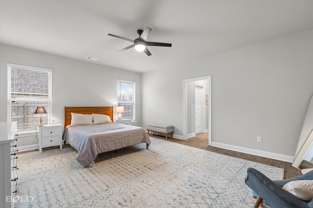 bedroom with ceiling fan and light hardwood / wood-style floors