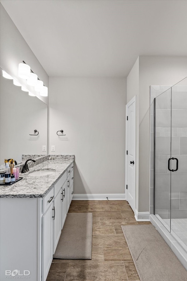 bathroom featuring vanity and walk in shower