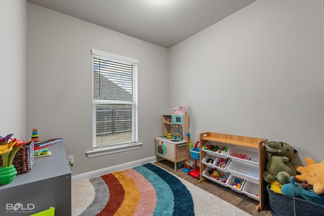 game room featuring dark wood-type flooring