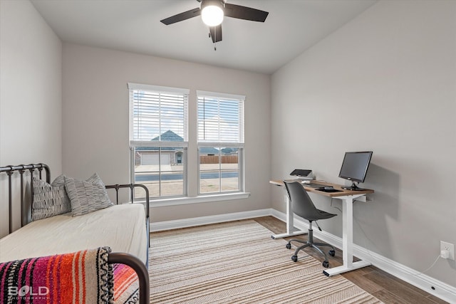 home office featuring hardwood / wood-style flooring and ceiling fan