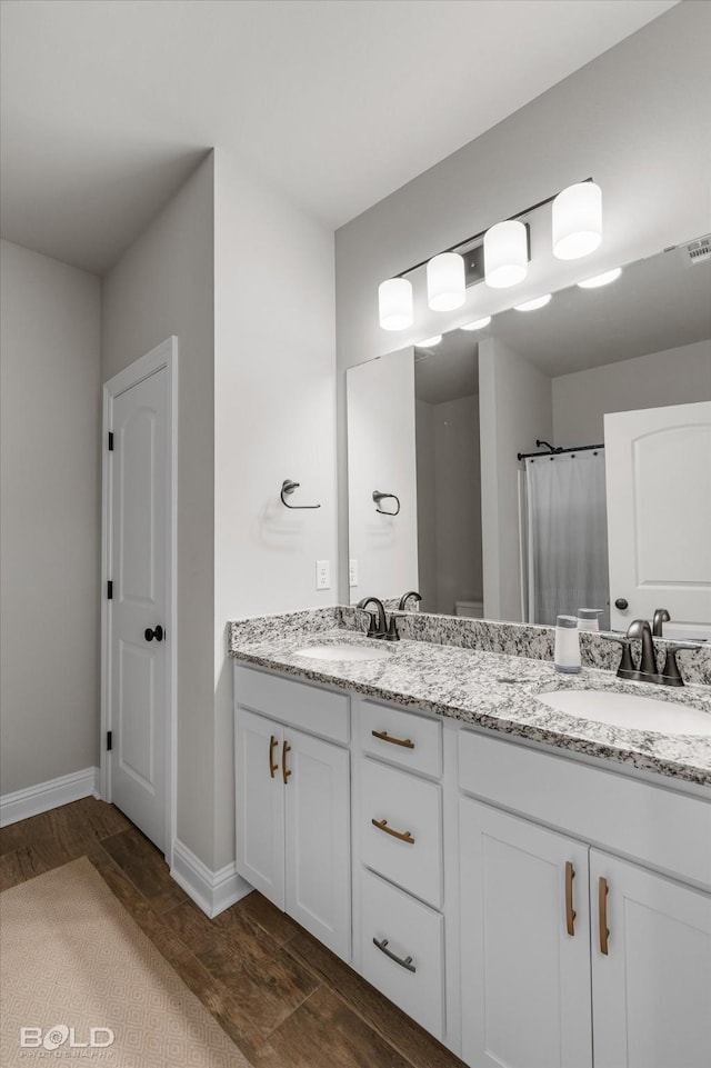 bathroom with vanity, hardwood / wood-style floors, and a shower with shower curtain