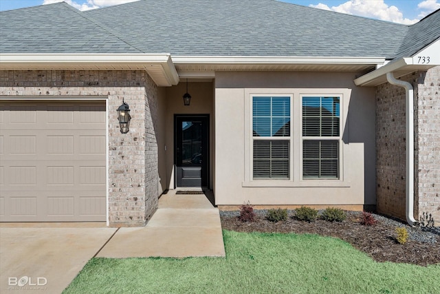 view of exterior entry featuring a garage