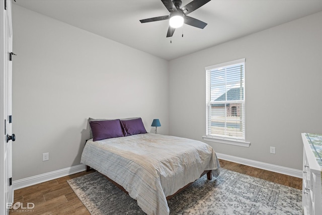 bedroom featuring dark hardwood / wood-style floors and ceiling fan