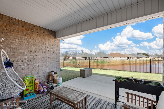 view of patio with a water view