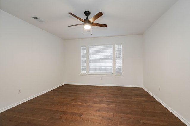 unfurnished room with dark wood-type flooring and ceiling fan