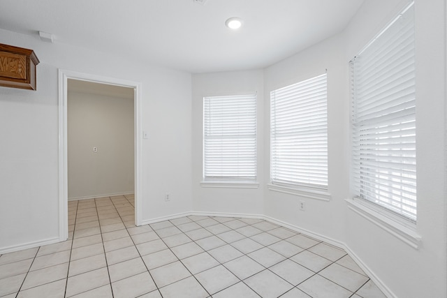 empty room with light tile patterned flooring