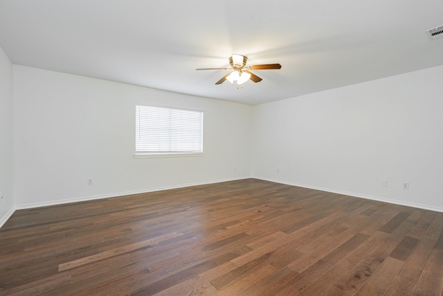 unfurnished room featuring ceiling fan and dark hardwood / wood-style flooring