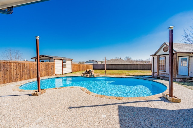 view of pool featuring an outbuilding