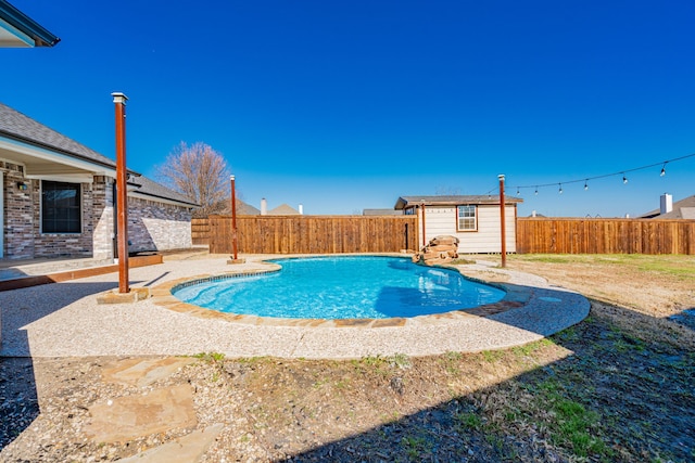 view of pool featuring a storage shed