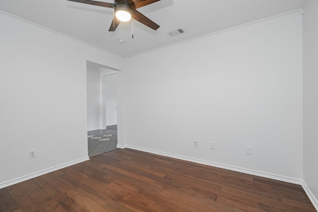 spare room with dark hardwood / wood-style flooring, crown molding, and ceiling fan