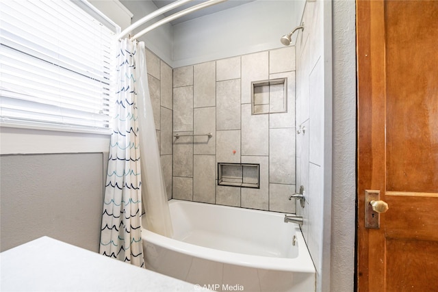 bathroom with shower / bath combo