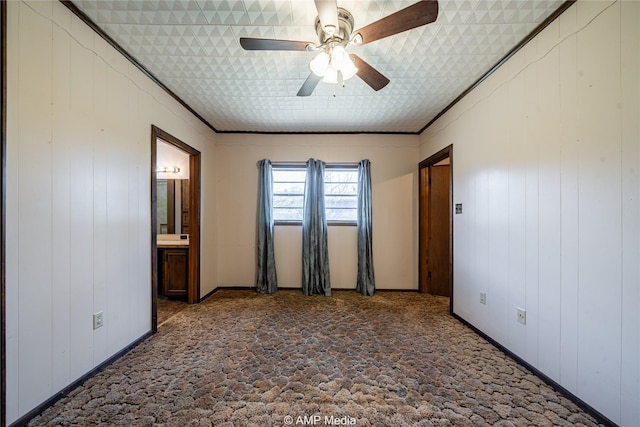 unfurnished bedroom featuring ceiling fan and ornamental molding