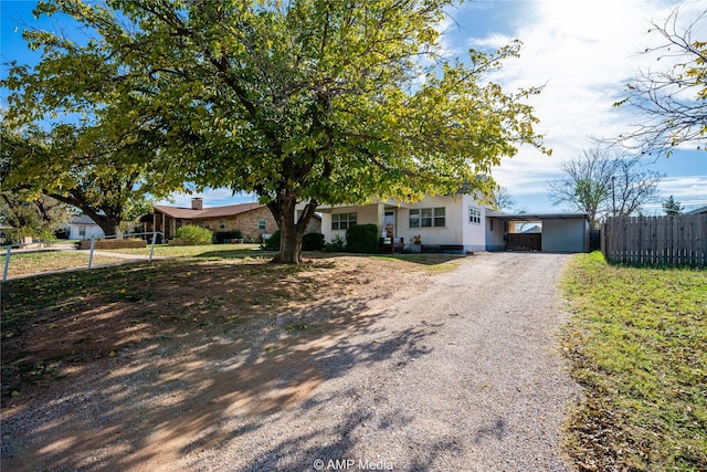 view of front of home with a carport