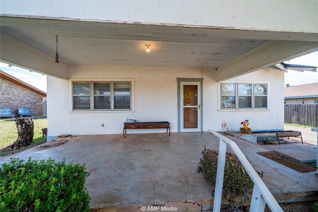 entrance to property with a patio