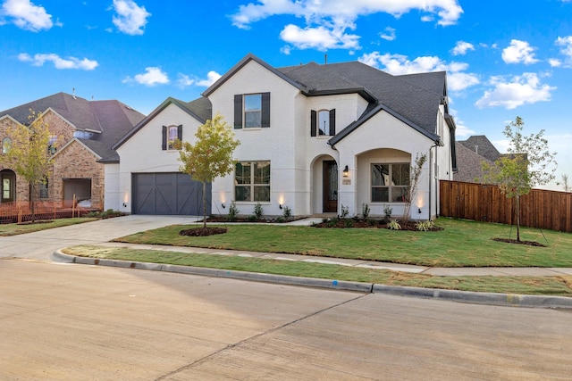 french country style house featuring a front lawn