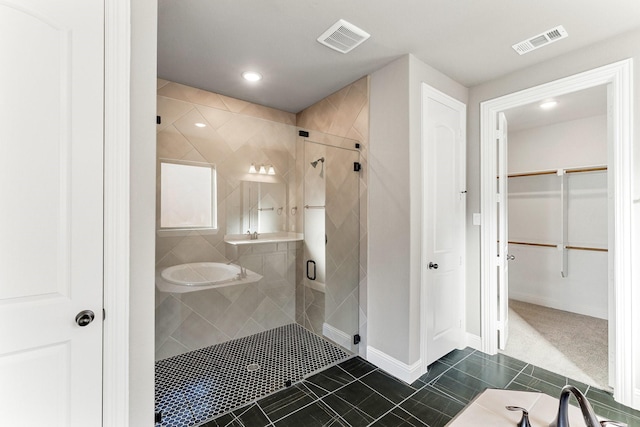 bathroom featuring tile patterned floors and walk in shower