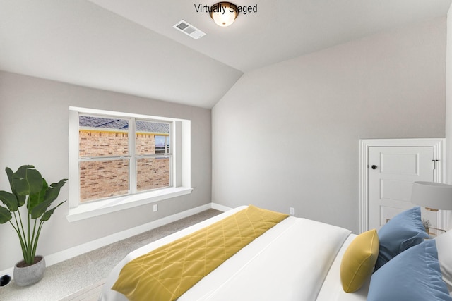 bedroom featuring carpet and lofted ceiling