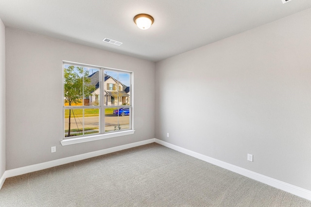 unfurnished room featuring carpet floors