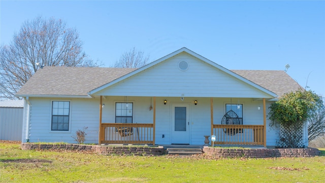 view of front facade with covered porch and a front lawn