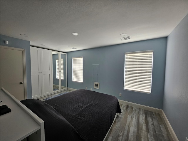 bedroom featuring dark hardwood / wood-style floors