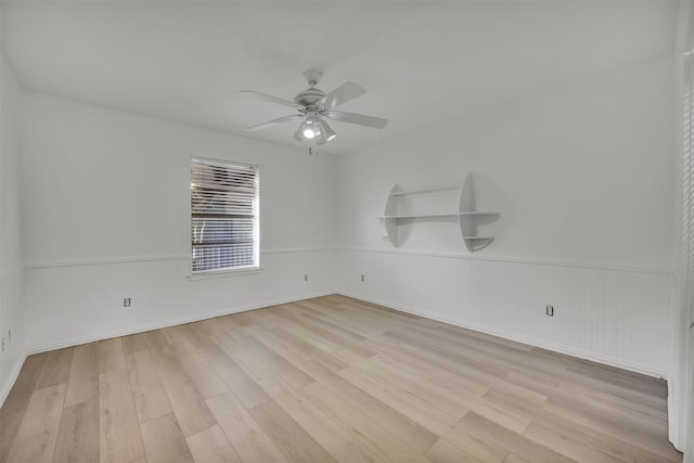 spare room featuring ceiling fan and light wood-type flooring