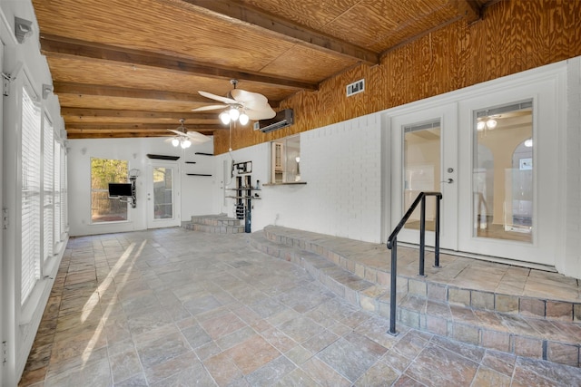 view of patio / terrace with a wall mounted AC, french doors, and ceiling fan