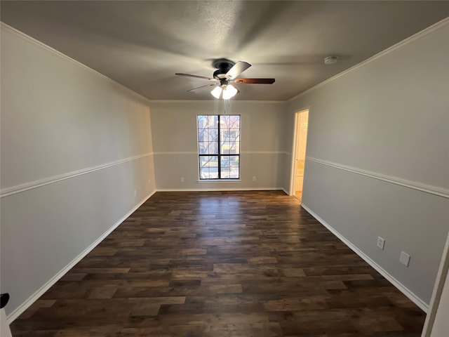 unfurnished room featuring dark wood-type flooring, ceiling fan, and ornamental molding