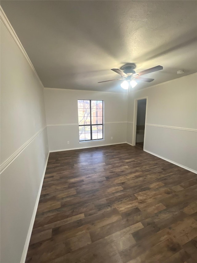 unfurnished room with ceiling fan, crown molding, and dark hardwood / wood-style flooring