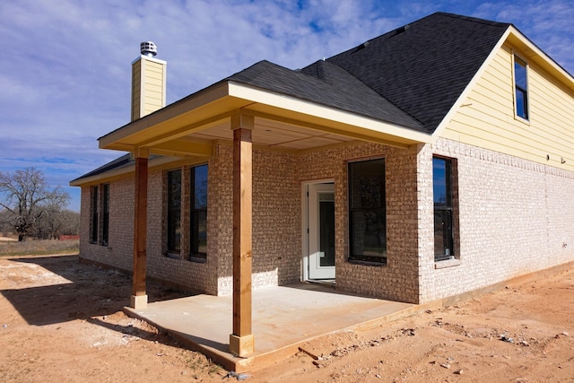 rear view of property with a patio area