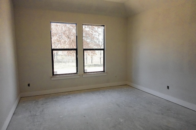 spare room with concrete flooring