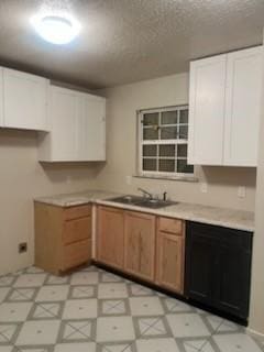 kitchen featuring sink, a textured ceiling, dishwasher, and white cabinets