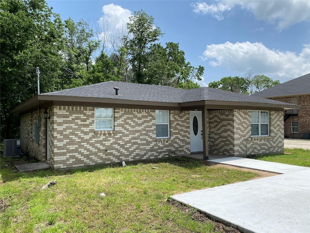 single story home featuring central AC, a patio area, and a front lawn