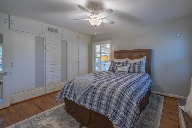 bedroom featuring dark hardwood / wood-style flooring and ceiling fan