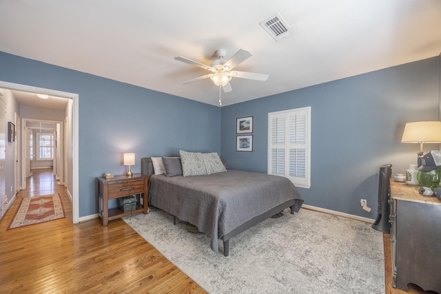 bedroom with hardwood / wood-style flooring and ceiling fan