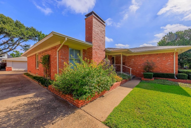 view of side of property with a yard