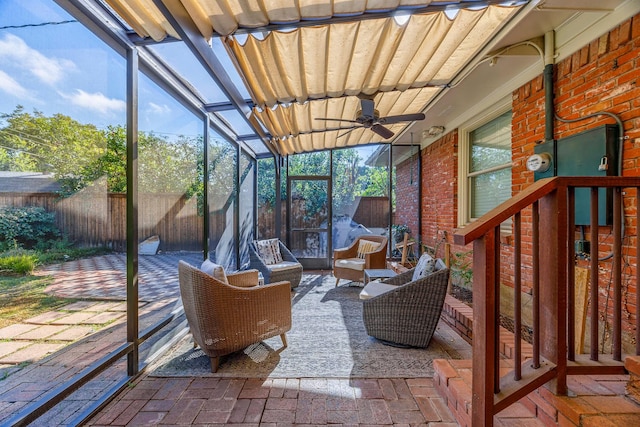 sunroom featuring ceiling fan