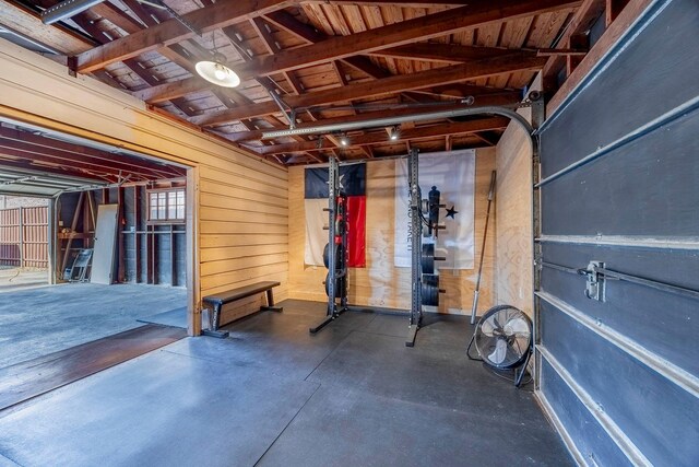 exercise room featuring wooden walls