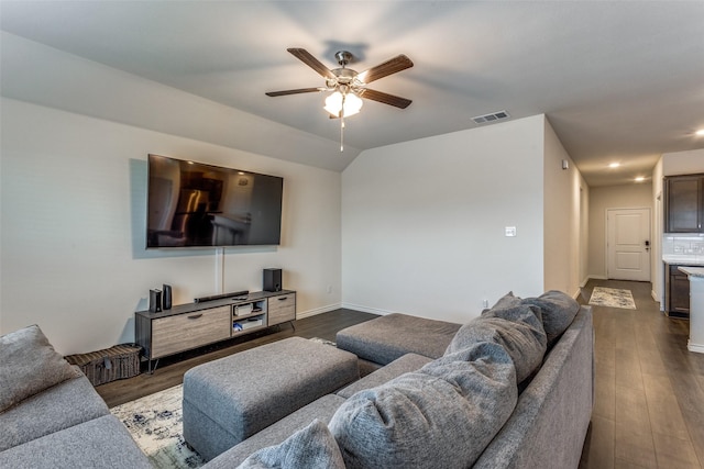 living room featuring lofted ceiling, dark hardwood / wood-style floors, and ceiling fan