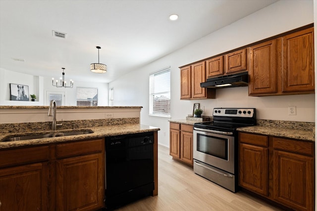 kitchen with stainless steel electric range oven, stone countertops, dishwasher, sink, and light hardwood / wood-style flooring