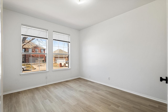 spare room with light hardwood / wood-style floors