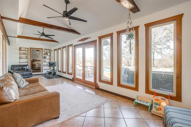 sunroom with vaulted ceiling with beams and french doors