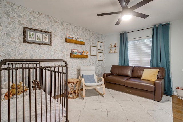 living room featuring ceiling fan and light hardwood / wood-style floors