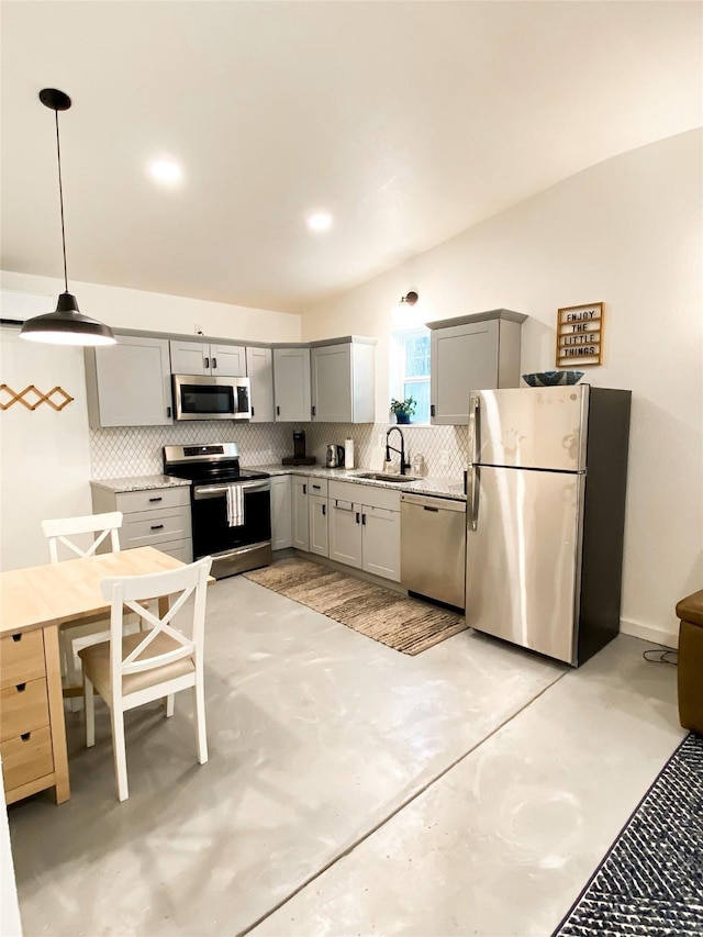 kitchen with sink, appliances with stainless steel finishes, gray cabinets, pendant lighting, and backsplash