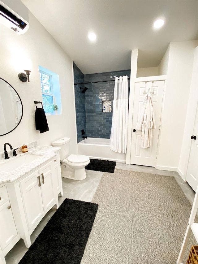 full bathroom featuring shower / bath combo, vanity, and toilet