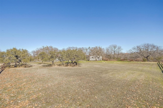 view of yard with a rural view