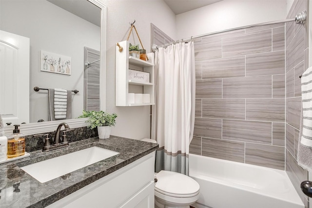 full bathroom featuring vanity, toilet, and shower / tub combo