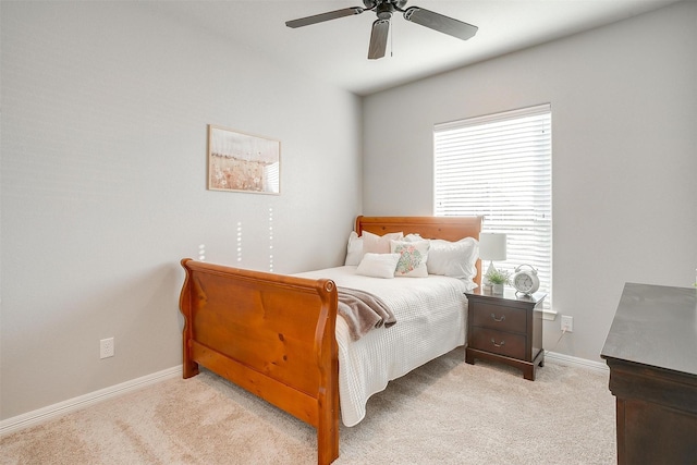 bedroom featuring ceiling fan and light carpet