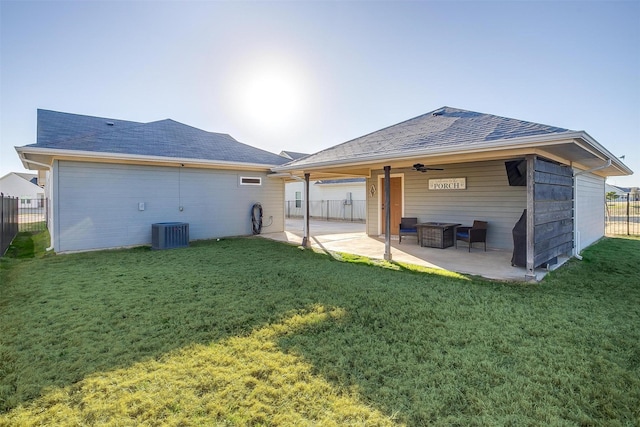 rear view of house featuring a patio, ceiling fan, and a lawn